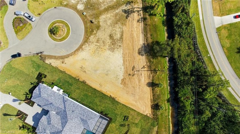 Set within the prestigious, gated enclave of Devonwood, this - Beach Lot for sale in Fort Myers, Florida on Beachhouse.com