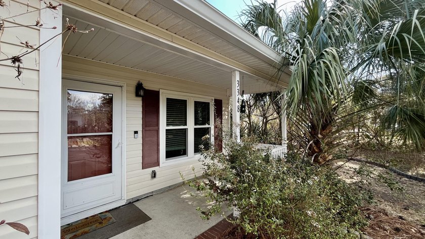 Nestled behind mature native landscaping, this home doesn't just - Beach Home for sale in Johns Island, South Carolina on Beachhouse.com