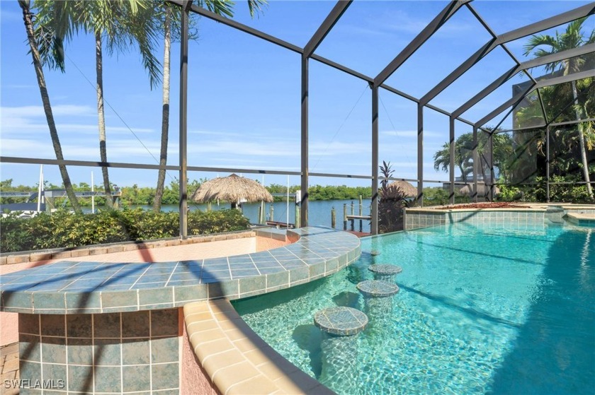 This gorgeous home sits on a sailboat Gulf access canal with a - Beach Home for sale in Cape Coral, Florida on Beachhouse.com