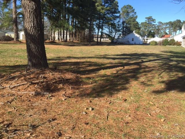 Level building site in quiet community with some water view and - Beach Lot for sale in Deltaville, Virginia on Beachhouse.com
