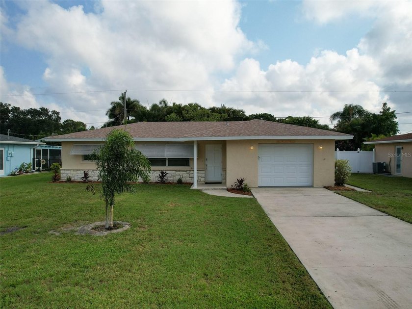 Welcome to this charming 3-bedroom, 2-bath home with NEW ROOF - Beach Home for sale in Englewood, Florida on Beachhouse.com