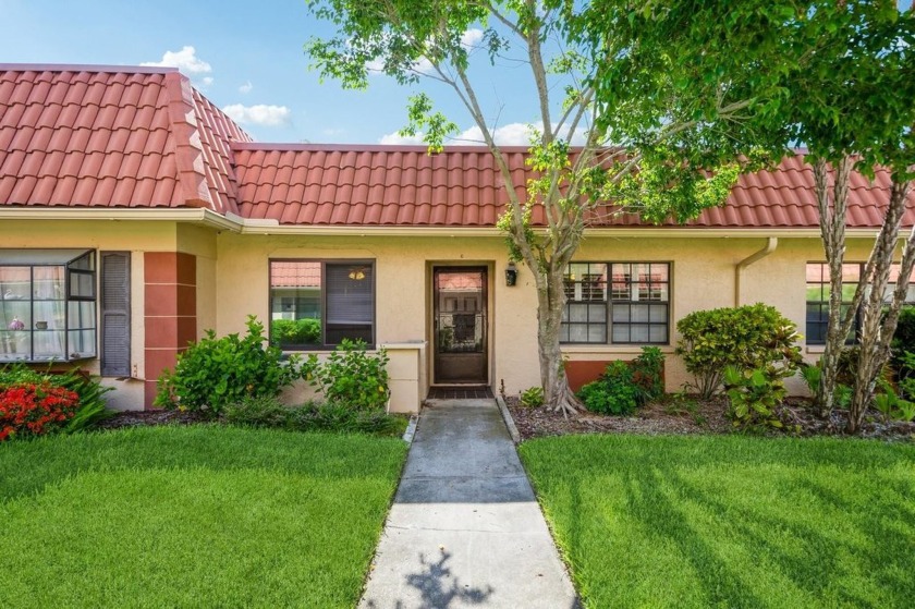 Welcome to this move-in ready one-story villa nestled in the - Beach Home for sale in Clearwater, Florida on Beachhouse.com