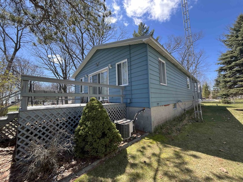 Charming Saginaw Bay Ranch with 50 Feet of Waterfront Frontage! - Beach Home for sale in Pinconning, Michigan on Beachhouse.com