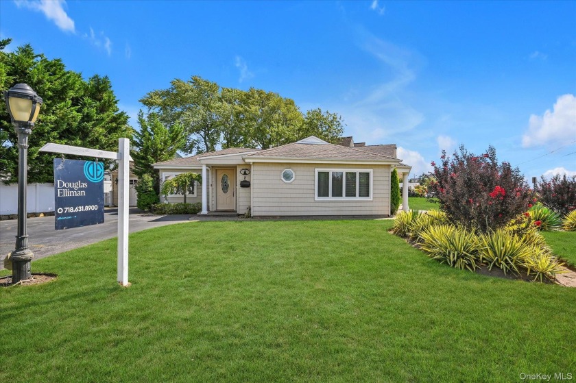 Welcome to this immaculate corner ranch home with water view - Beach Home for sale in Massapequa, New York on Beachhouse.com