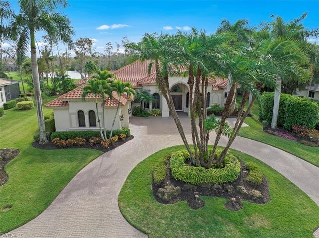 Drive up to the wide circular paved driveway surrounded by lush - Beach Home for sale in Estero, Florida on Beachhouse.com