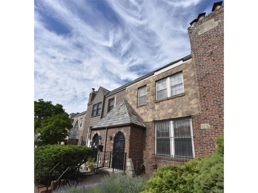 Welcome to this charming brick Tudor single family home nestled - Beach Home for sale in East Elmhurst, New York on Beachhouse.com