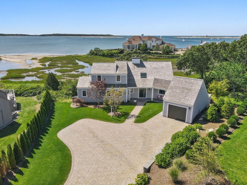 Spectacularly positioned overlooking Lewis Bay, this waterfront - Beach Home for sale in West Yarmouth, Massachusetts on Beachhouse.com