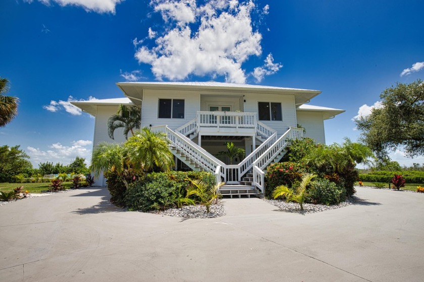 Nestled in a serene enclave, this exceptional property - Beach Home for sale in Placida, Florida on Beachhouse.com