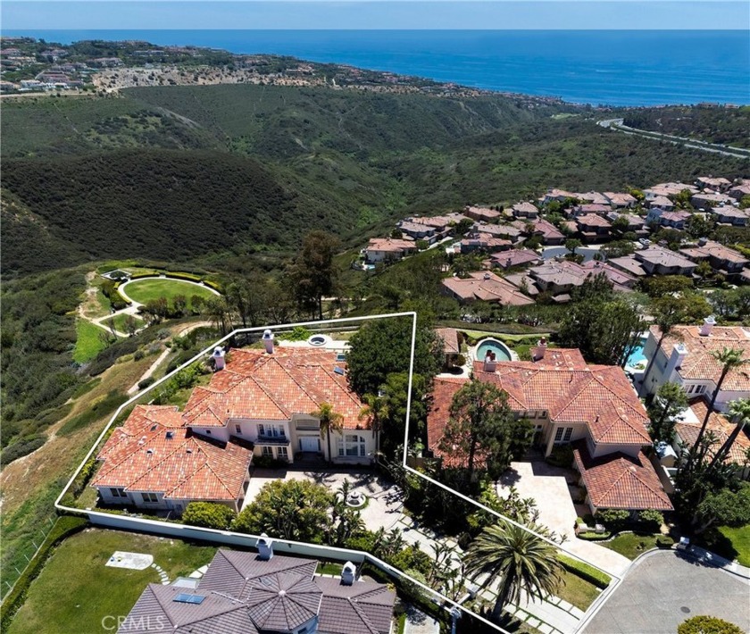 Perched on a coveted peninsula lot within the guard-gated - Beach Home for sale in Newport Coast, California on Beachhouse.com