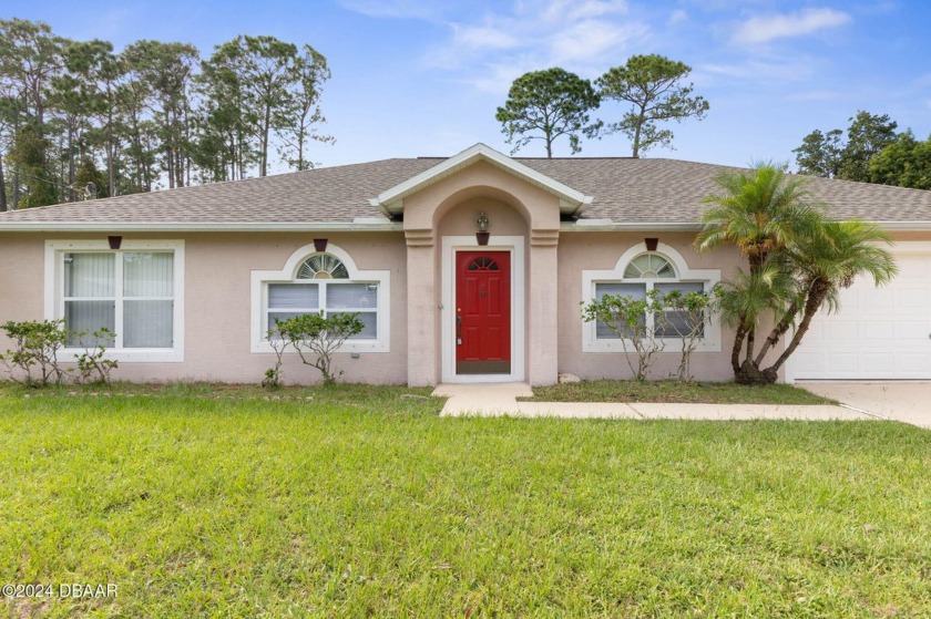 Welcome to this stunning 4-bedroom, 2-bathroom home offering - Beach Home for sale in Palm Coast, Florida on Beachhouse.com