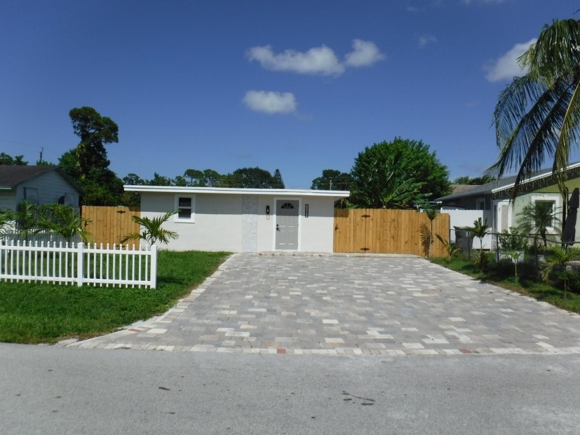 Amazing opportunity to own a newly renotaved cozy cottage with - Beach Home for sale in West Palm Beach, Florida on Beachhouse.com