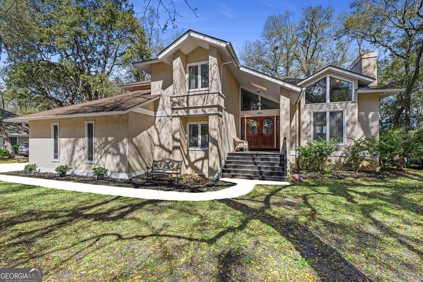 Nestled among mature oak trees along Borrell Creek with - Beach Home for sale in Saint Marys, Georgia on Beachhouse.com
