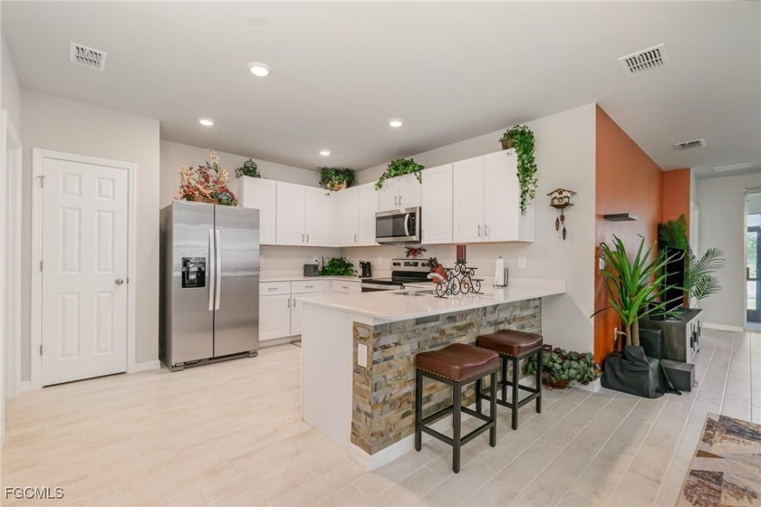 VIBRANT, CHARACTER-FILLED NEWER CONSTRUCTION HOME WITH GOLF & - Beach Home for sale in North Fort Myers, Florida on Beachhouse.com