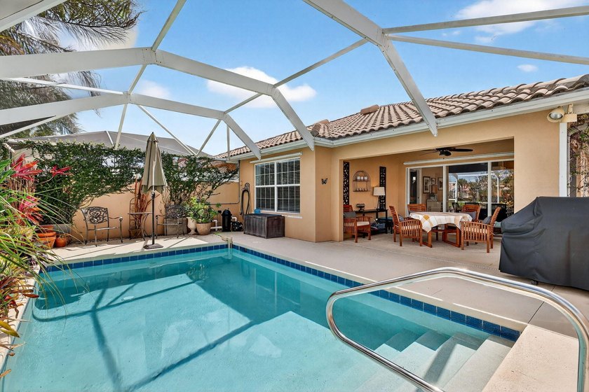 Immaculate villa offering a heated, screened-in pool with - Beach Home for sale in Port Saint Lucie, Florida on Beachhouse.com
