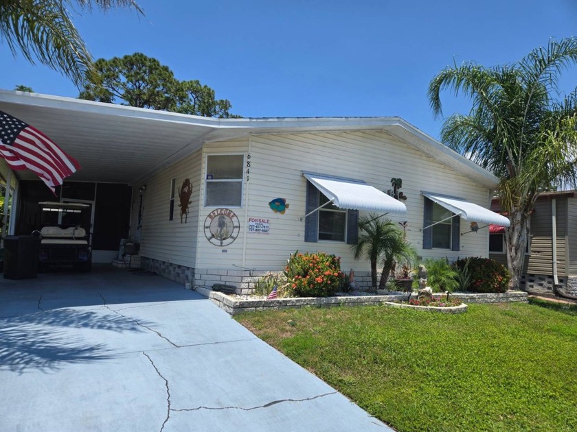 THIS LOVELY HOME BOASTS OF BEING ALMOST 1500 SQ. FT OF LIVING - Beach Home for sale in New Port Richey, Florida on Beachhouse.com