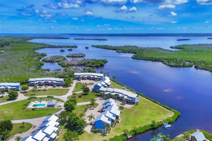 (One photo has been virtually staged) You'll fall in love with - Beach Condo for sale in Bokeelia, Florida on Beachhouse.com