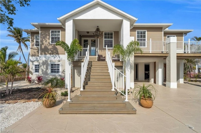 Nestled on an oversized lot with unparalleled curb appeal, this - Beach Home for sale in Fort Myers Beach, Florida on Beachhouse.com