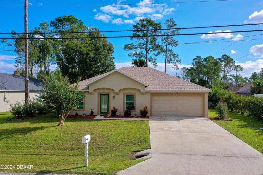 This beautifully maintained 3-bedroom, 2-bath home, located in - Beach Home for sale in Palm Coast, Florida on Beachhouse.com