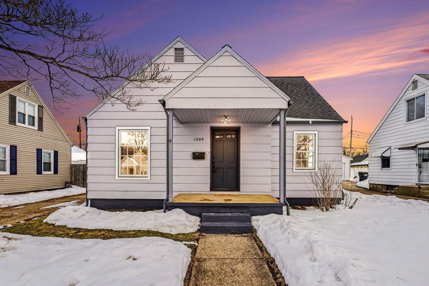 This beautifully updated 5-bedroom, 2-bath Cape Cod offers the - Beach Home for sale in Saint Joseph, Michigan on Beachhouse.com