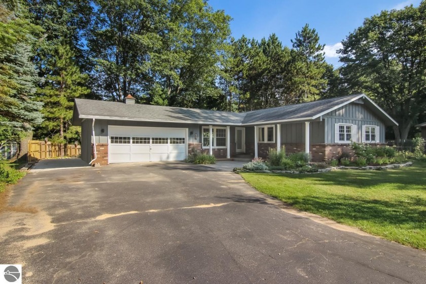 This move-in ready 3 bed/2 bathroom ranch home is situated on a - Beach Home for sale in Traverse City, Michigan on Beachhouse.com