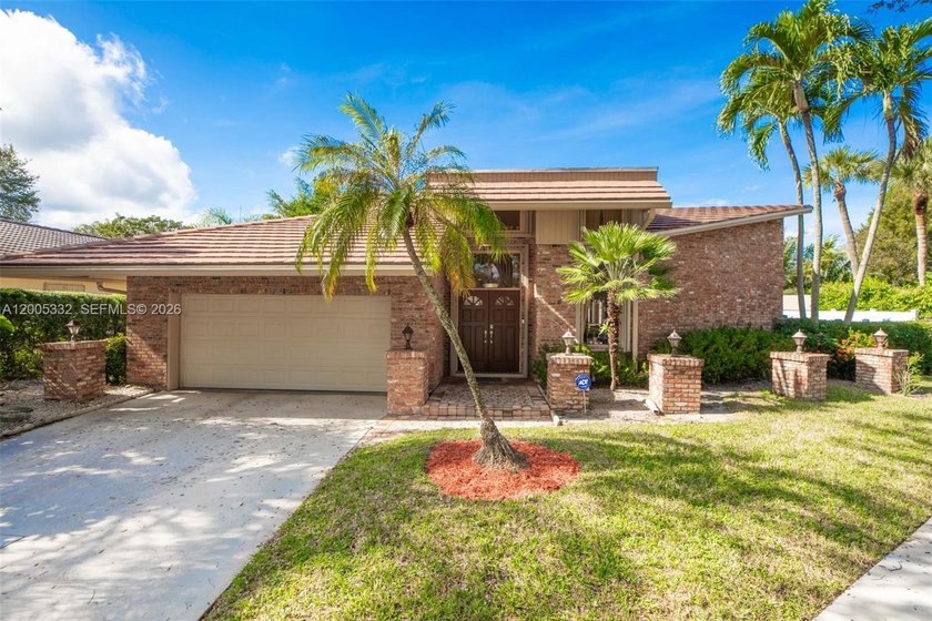 RARELY AVAILABLE IN WHISPERING WOODS! Experience elevated South - Beach Home for sale in Boca Raton, Florida on Beachhouse.com