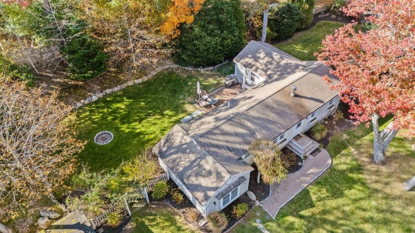 Nestled on a corner lot with serene views of Santuit Pond, this - Beach Home for sale in Mashpee, Massachusetts on Beachhouse.com