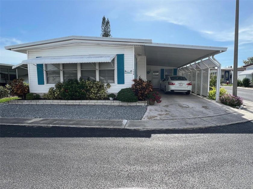 Positioned within the vibrant Palm Hill Country Club, a - Beach Home for sale in Largo, Florida on Beachhouse.com