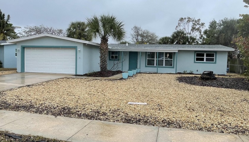 Beautifully renovated 4 bedroom 2 bath canal home located in - Beach Home for sale in Indian Harbour Beach, Florida on Beachhouse.com