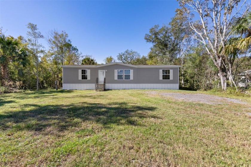 Experience the charm of 1328 County Rd 305, a newly constructed - Beach Home for sale in Bunnell, Florida on Beachhouse.com