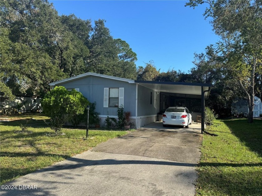 Check out this 3/2 split-level home situated on a peaceful - Beach Home for sale in Daytona Beach, Florida on Beachhouse.com