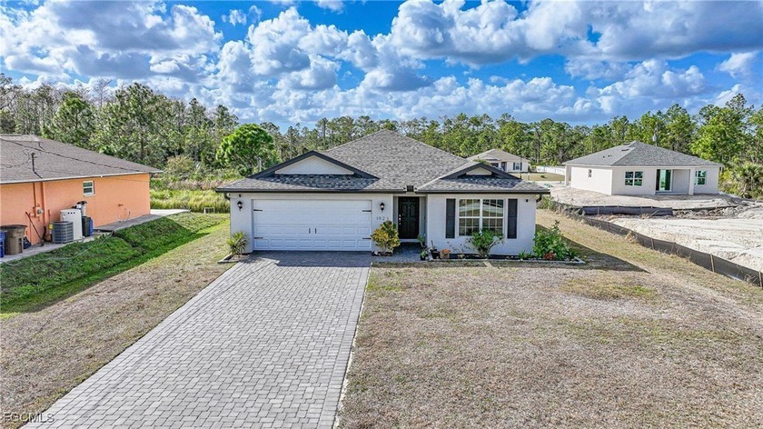 Welcome to this beautiful 2022-built home located in the heart - Beach Home for sale in Lehigh Acres, Florida on Beachhouse.com