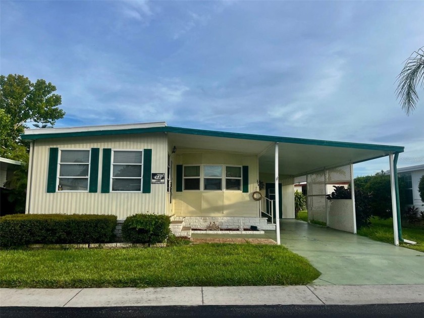 Your Move-In Ready Oasis Awaits as you step into this charming - Beach Home for sale in Tarpon Springs, Florida on Beachhouse.com