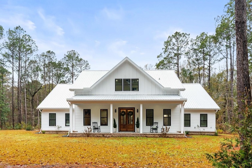 Tucked away on 1.25 private acres in Awendaw, this custom home - Beach Home for sale in Awendaw, South Carolina on Beachhouse.com