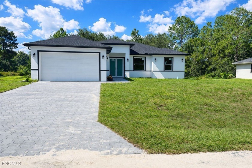 Step into contemporary living with this newly constructed - Beach Home for sale in Lehigh Acres, Florida on Beachhouse.com