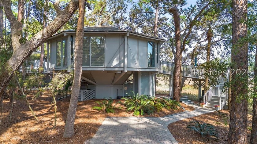 Nestled within a lush canopy of pines, oaks, and palms, this - Beach Home for sale in Hilton Head Island, South Carolina on Beachhouse.com