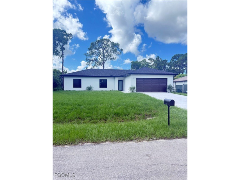 This charming home offers 3 Bedrooms,2 full baths and an - Beach Home for sale in Lehigh Acres, Florida on Beachhouse.com