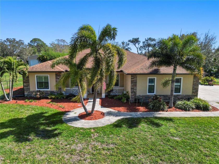 Nestled on over an acre of meticulously manicured land, this - Beach Home for sale in Nokomis, Florida on Beachhouse.com