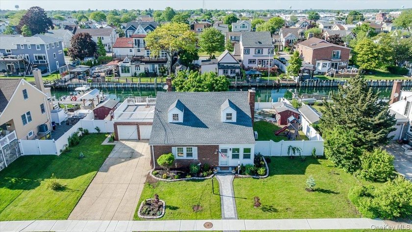 Enjoy your summer in this stunning waterfront retreat offering - Beach Home for sale in Freeport, New York on Beachhouse.com
