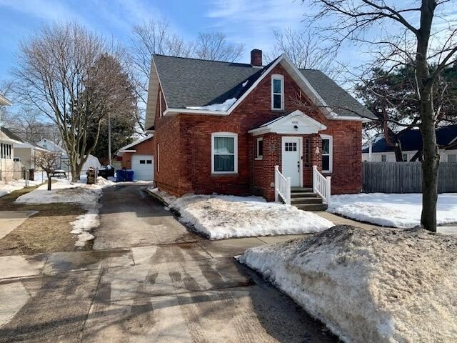 This lovely 4 bedroom, 2 full bath brick home was completely - Beach Home for sale in Ludington, Michigan on Beachhouse.com