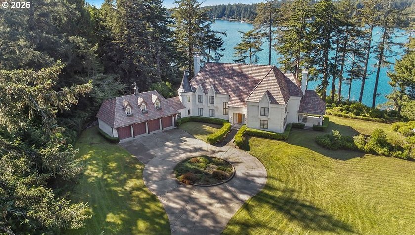 Tucked away on 20.29 lush waterfront acres with 1,358 feet of - Beach Home for sale in Florence, Oregon on Beachhouse.com