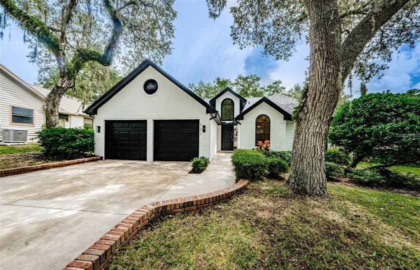 From the moment you arrive at 331 Cascade Lane, the home's - Beach Home for sale in Palm Harbor, Florida on Beachhouse.com