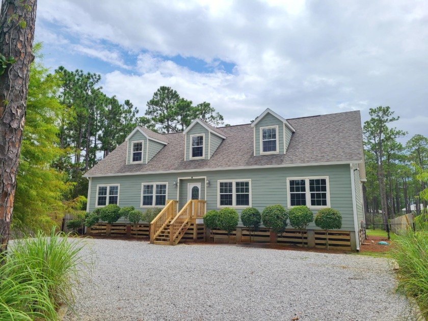 This 1/2 acre waterfront home is located just minutes from the - Beach Home for sale in Santa Rosa Beach, Florida on Beachhouse.com