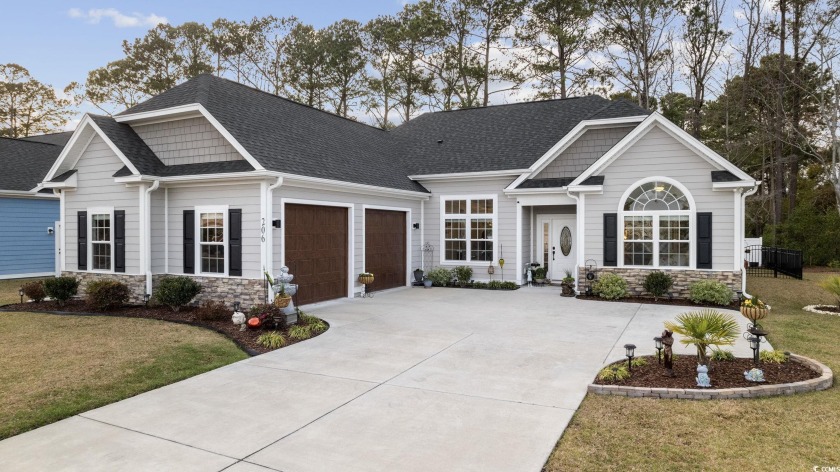 Discover coastal elegance nestled in the tranquil Windsong - Beach Home for sale in Little River, South Carolina on Beachhouse.com