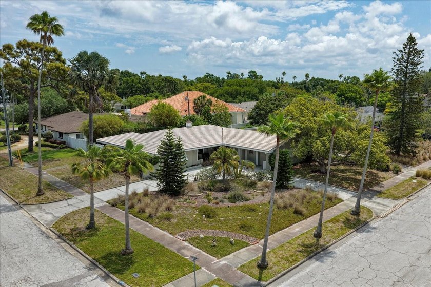 Tucked on a corner lot in the heart of Belleair, this unique - Beach Home for sale in Belleair Beach, Florida on Beachhouse.com