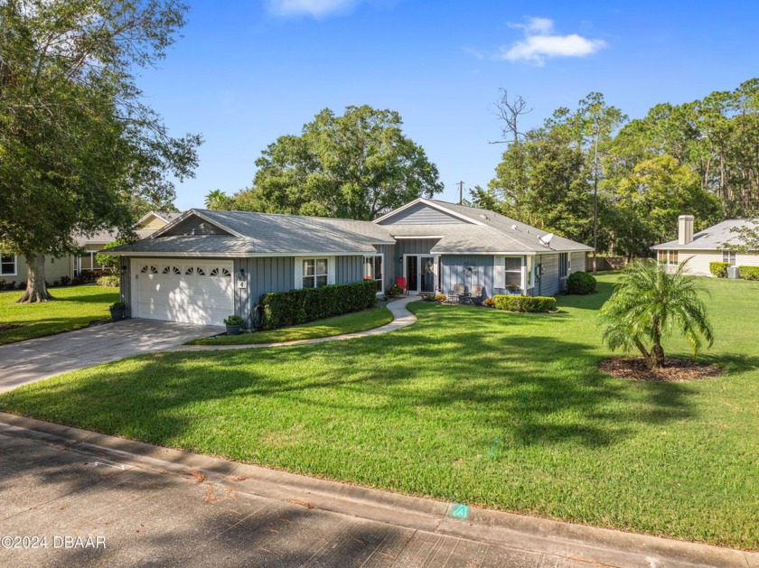 Welcome to 4 Treetop Trail, a stunning gem nestled in the highly - Beach Home for sale in Ormond Beach, Florida on Beachhouse.com