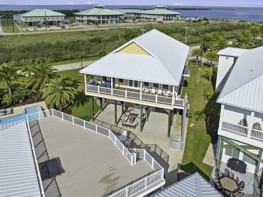 Welcome to a slice of paradise! Located on TWO lots in the gated - Beach Home for sale in Grand Isle, Louisiana on Beachhouse.com