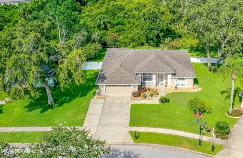 This is it! THIS HOME OFFERS A PRIVACE BACKING TO A WOODED - Beach Home for sale in Port Orange, Florida on Beachhouse.com