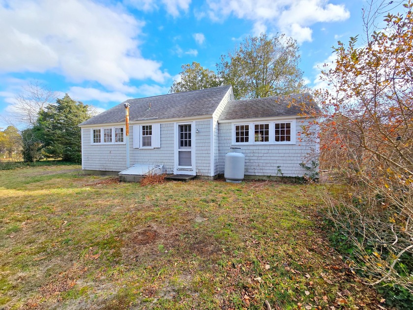 This vintage cottage on a beautiful, level lot just around the - Beach Home for sale in Orleans, Massachusetts on Beachhouse.com