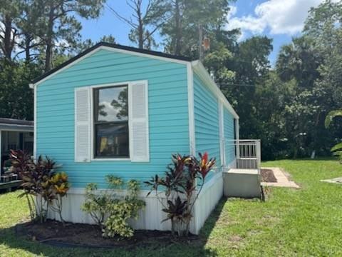 The exterior features a cheerful blue color with crisp white - Beach Home for sale in New Smyrna Beach, Florida on Beachhouse.com