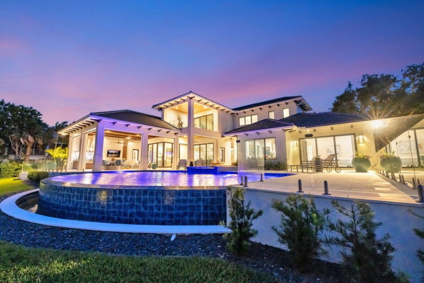 This BRAND NEW  CUSTOM WATERFRONT ESTATE home in a Prestigious - Beach Home for sale in Palm City, Florida on Beachhouse.com